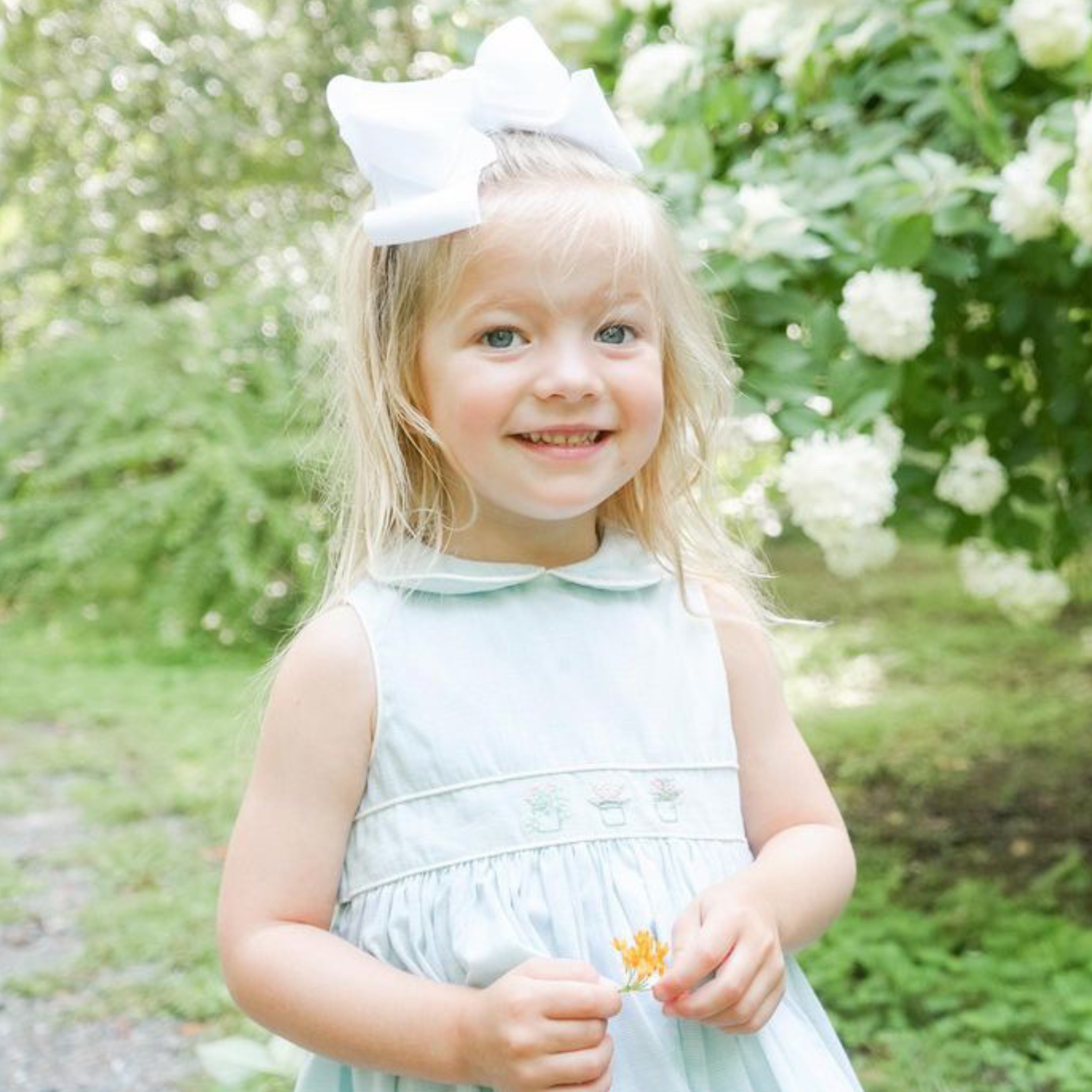 Charlotte sy Dimby classic timeless traditional smocked dresses for babies and girls handmade French style children clothing paris boutique twirling princess dress atlanta pastel soft green